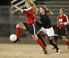 Brandon midfielder Perryn Tyler dribbles past a NWR defender. (Charles A. Smith/Special to the Ledger)